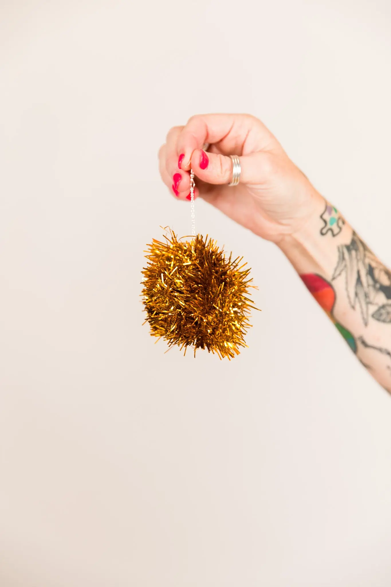 Gold Pom Pom Earrings - Image 2