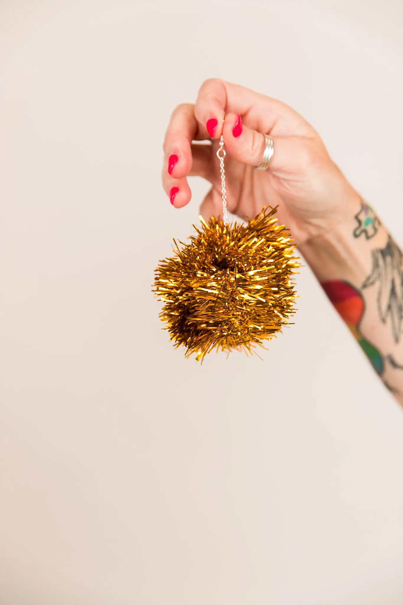 Gold Pom Pom Earrings - Image 7