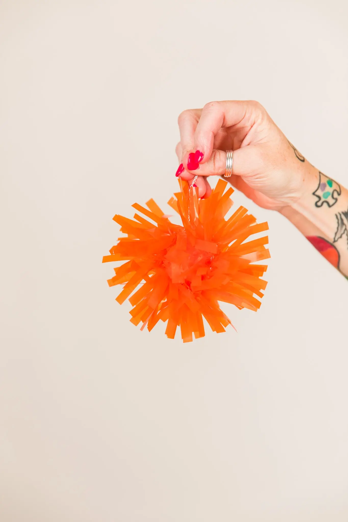 Orange Pom Pom Earrings - Image 2