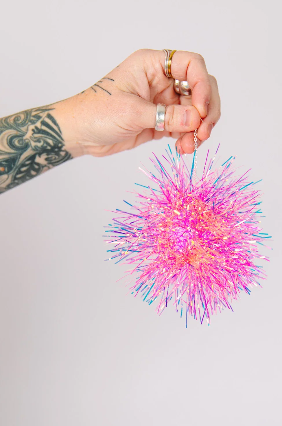 Pink Iridescent Party Pom Earrings - Image 3